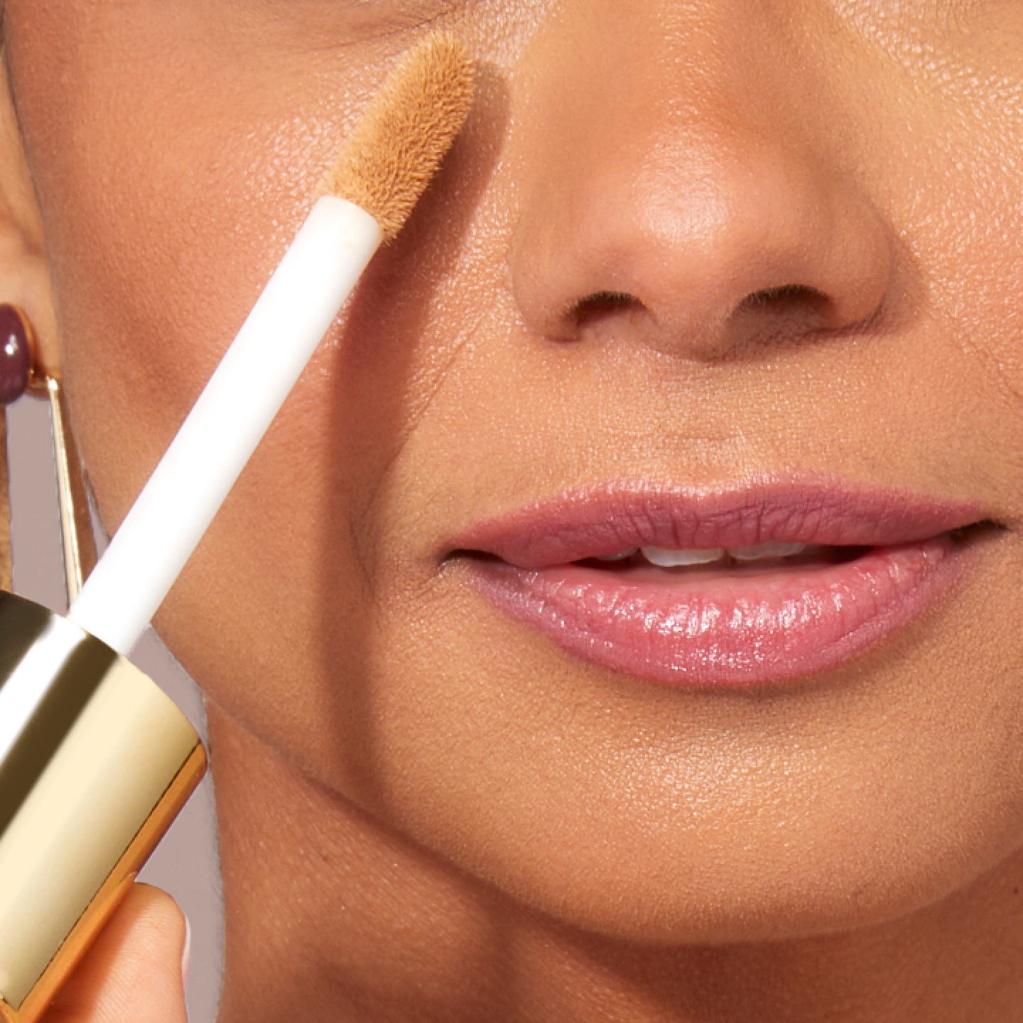 Model applying makeup