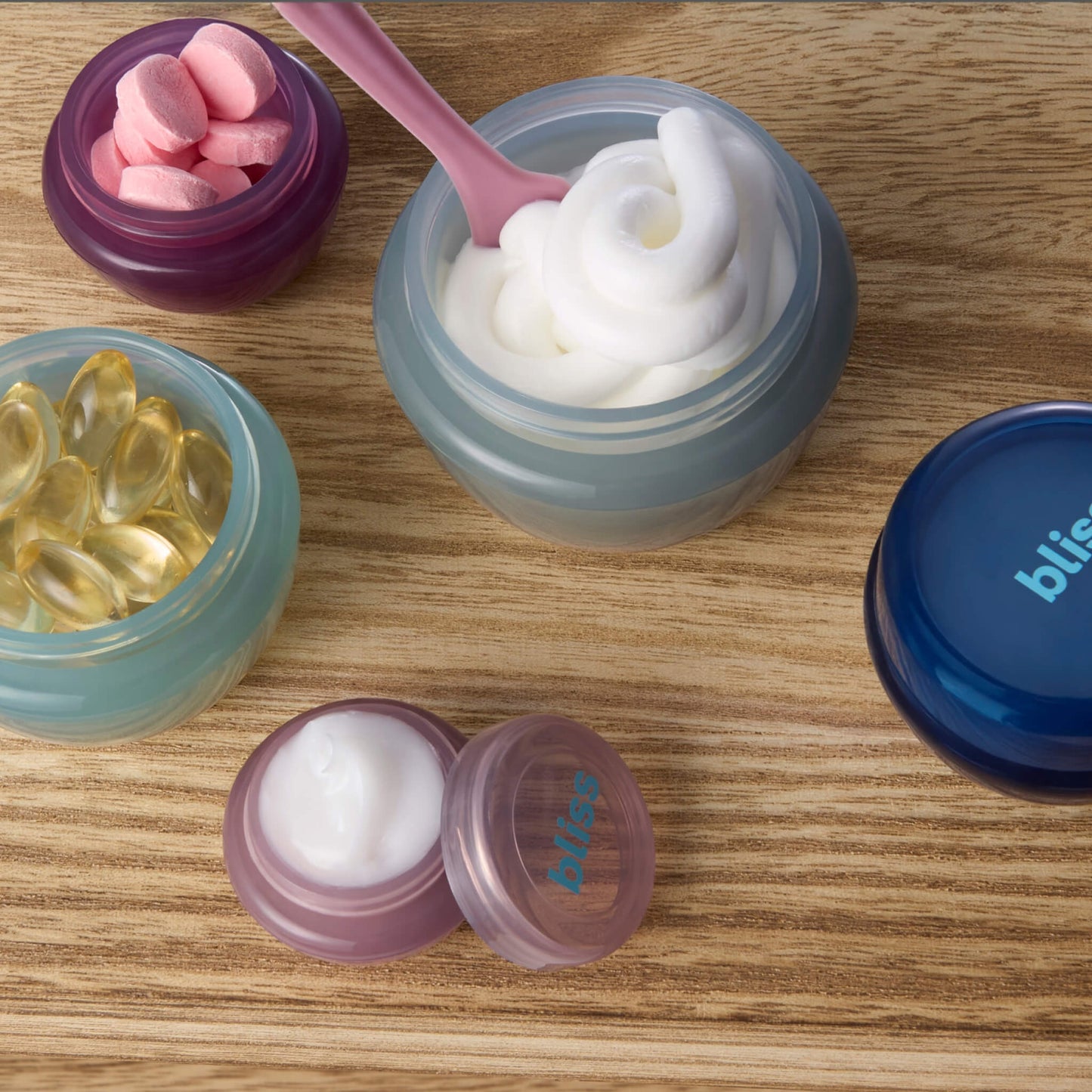Spa To Go Reusable Travel Jar + Spatula Set Lifestyle with jars filled