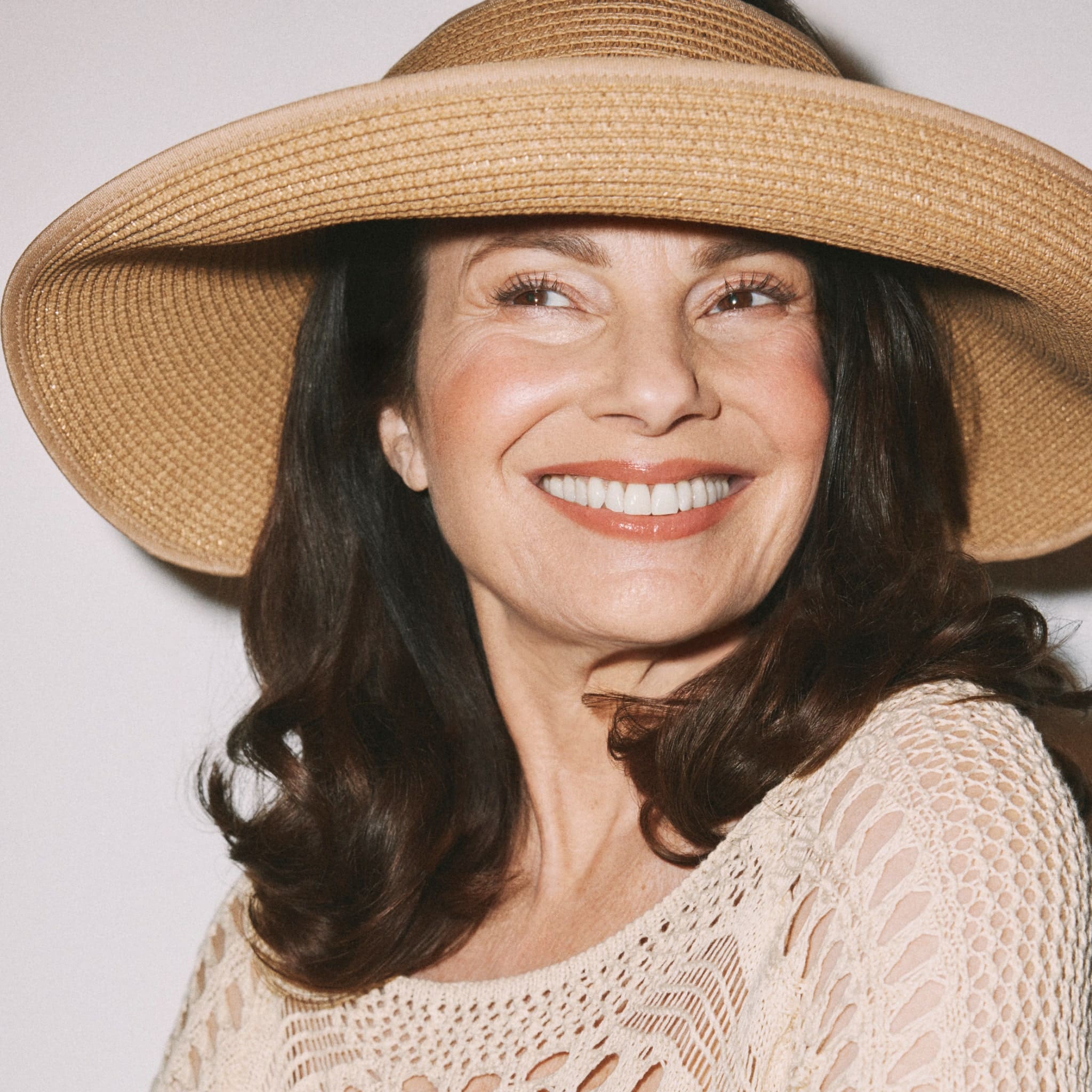 Fran Drescher wearing Laura Geller Sun Visor Hat