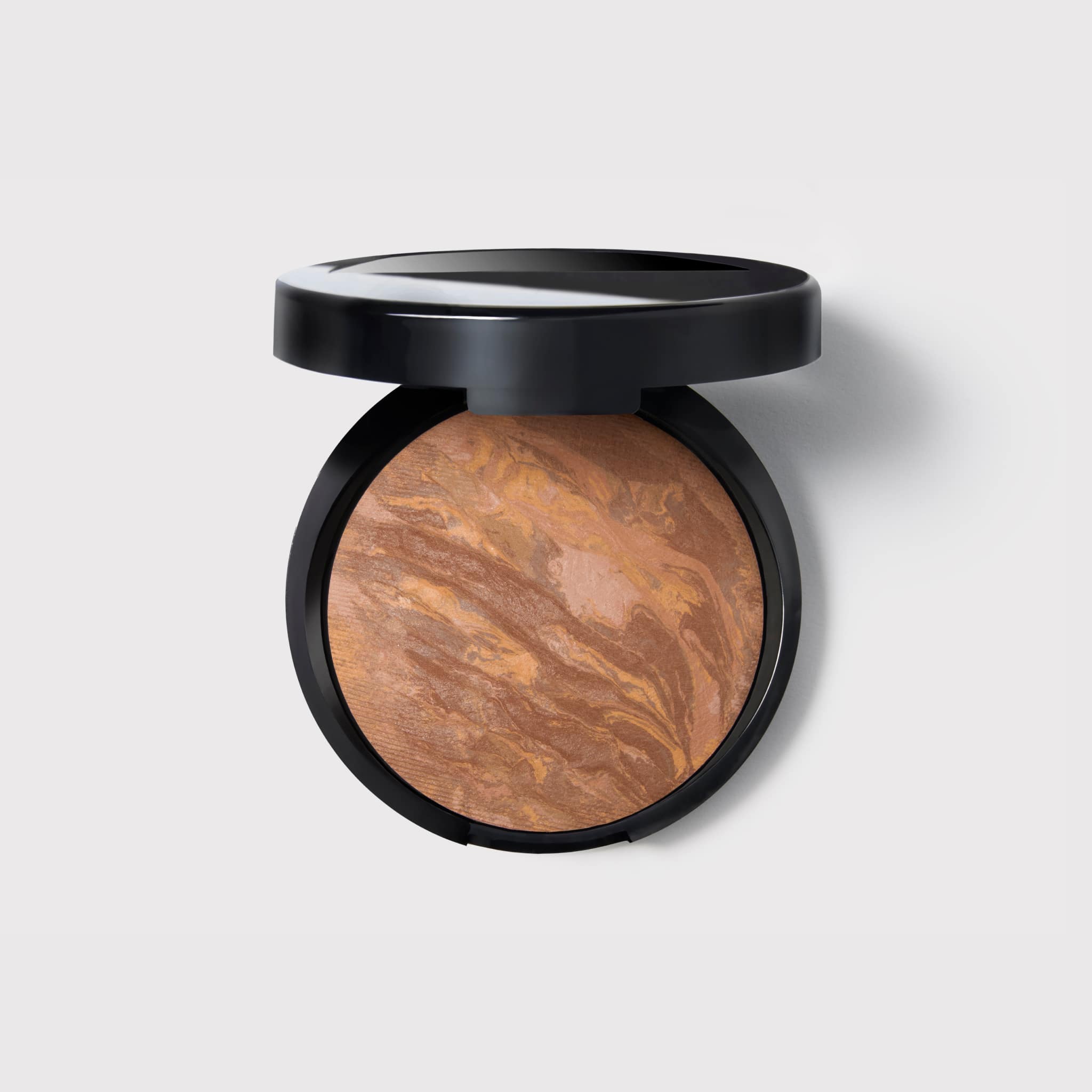 A single green leaf against a white background.