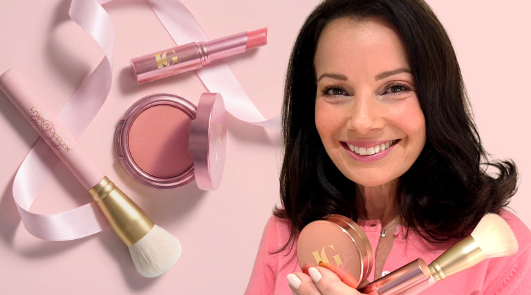 Fran Drescher holding the Cancer Schmancer Kit