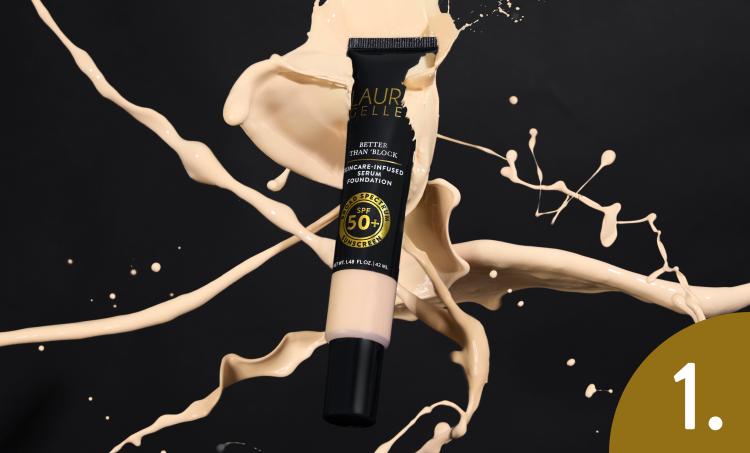 Cosmetic tube with Laura Geller logo on a black background with product splashes