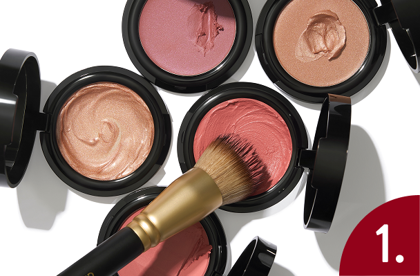 Laura Geller Wonder Balm and brush on a white background