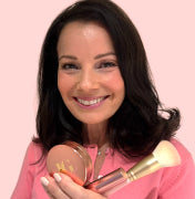 Fran Drescher holding Cancer Schmancer Kit 