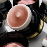 Home + Away Bronze-n-Brighten Kit (2 PC) lifestyle close up of Bronze-n-Brighten on the go 