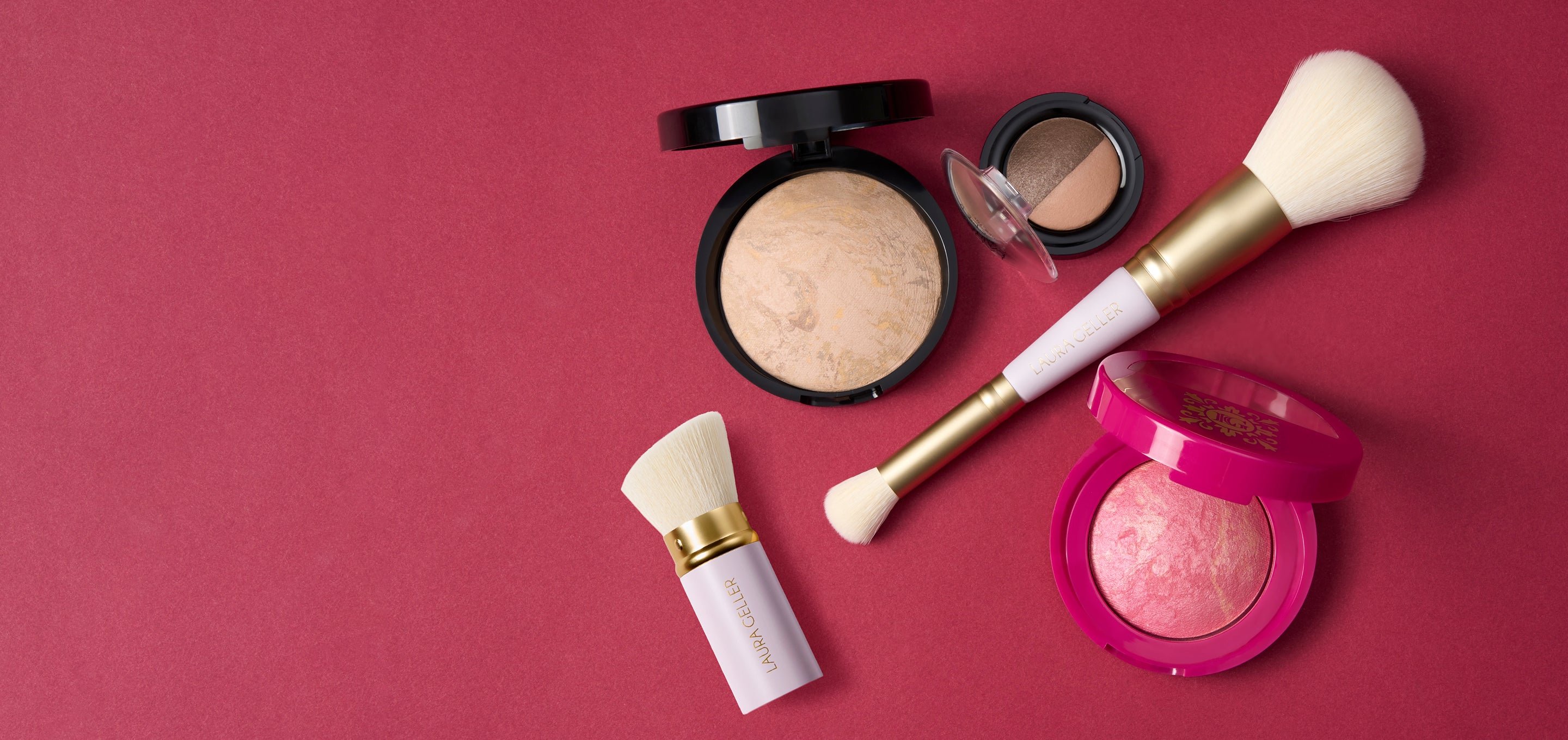 Laura Geller Holiday Daily Routine products on a red background