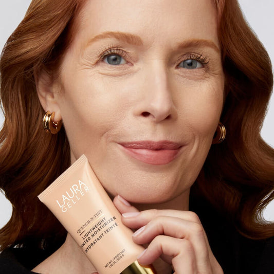 Woman holding Quench-n-Tint Lightweight Tinted Moisturizer