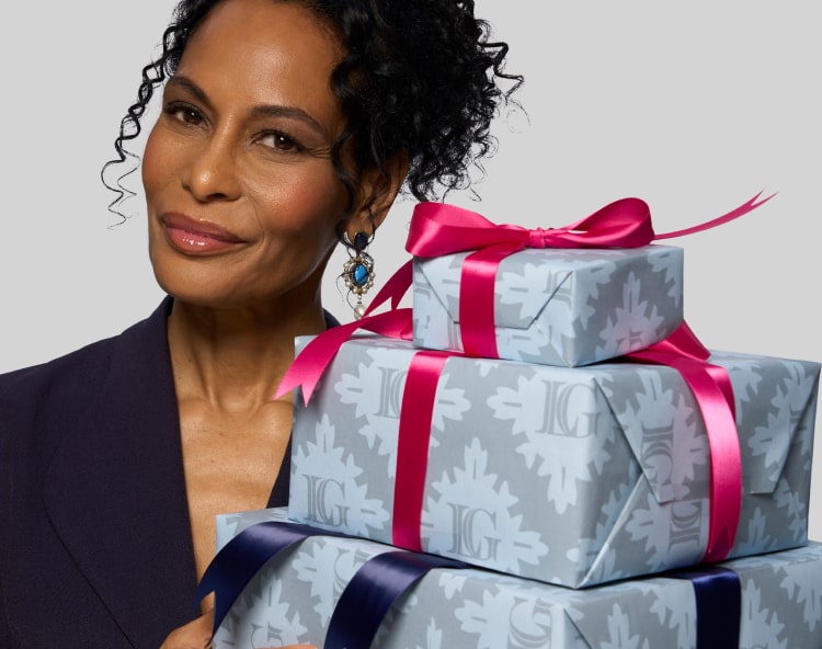 Laura Geller model with holiday presents 