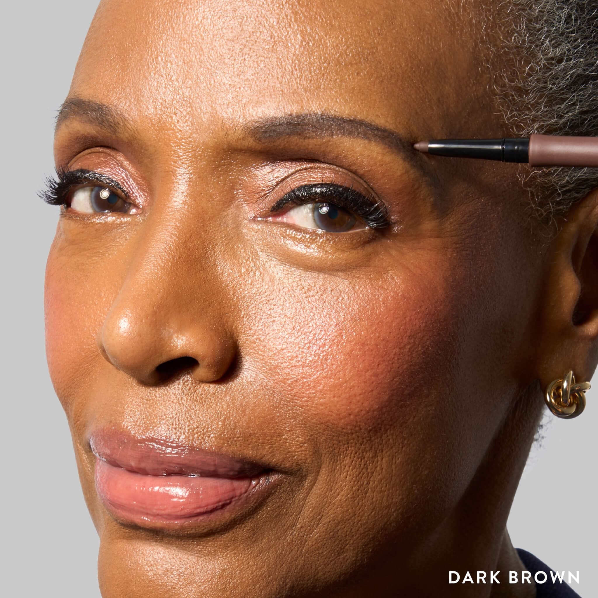 INKcredible Waterproof Brow Pencil model lifestyle in Dark Brown