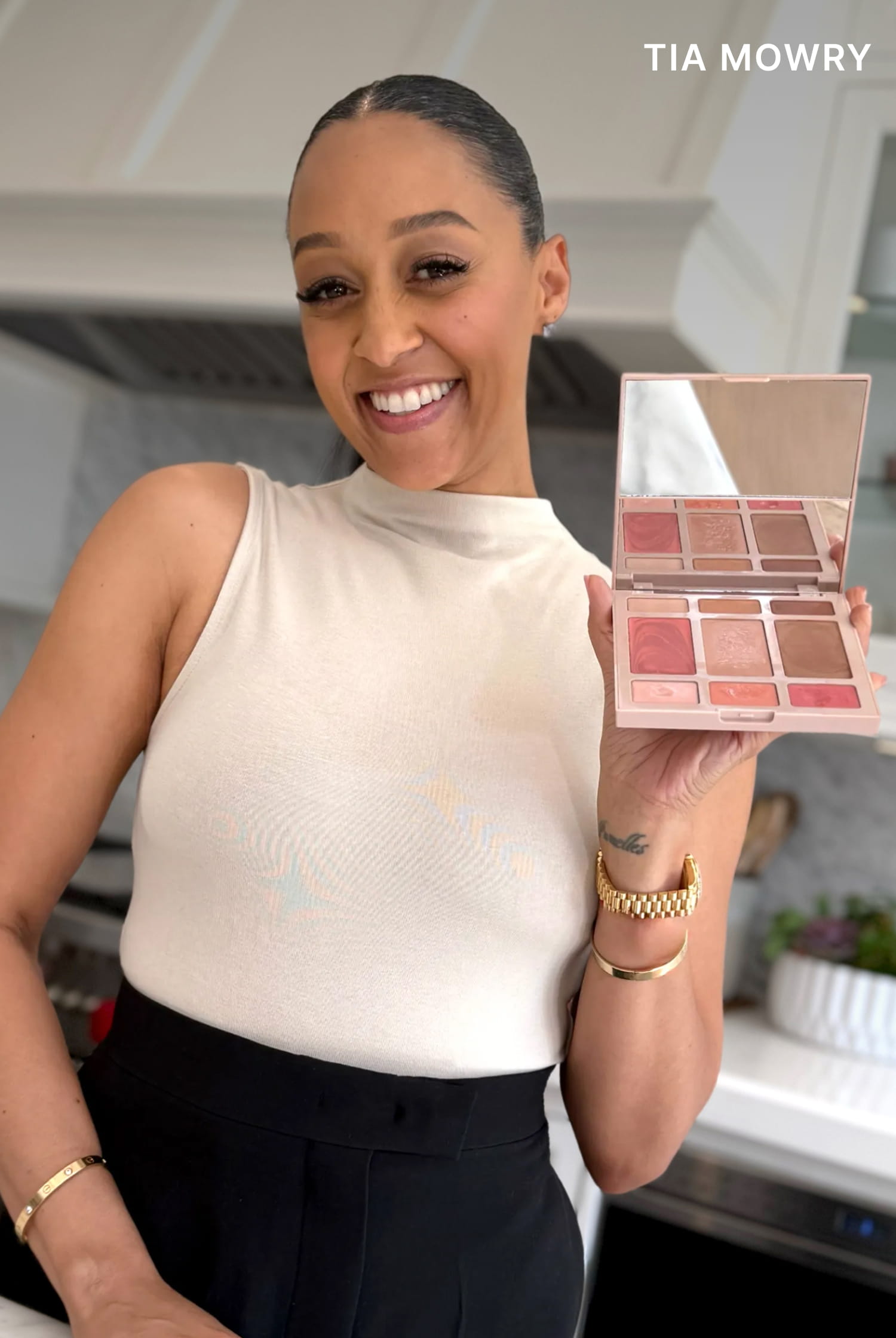 Tia Mowry holding Best of the Best Cream Full Face Palette