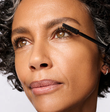 Model applying mascara