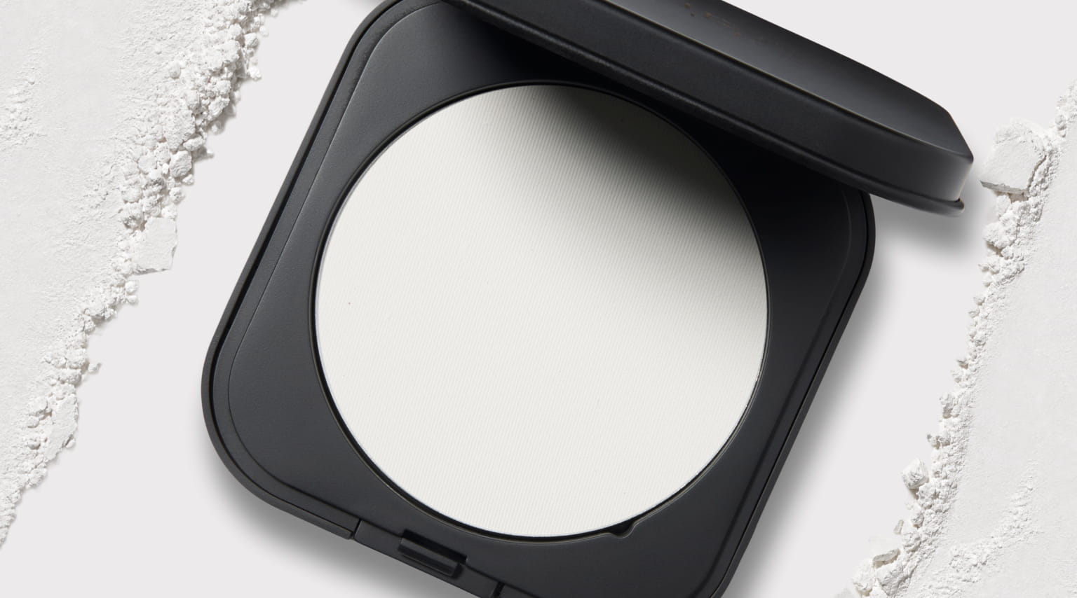 Laura Geller Matte Maker Setting Powder product with texture