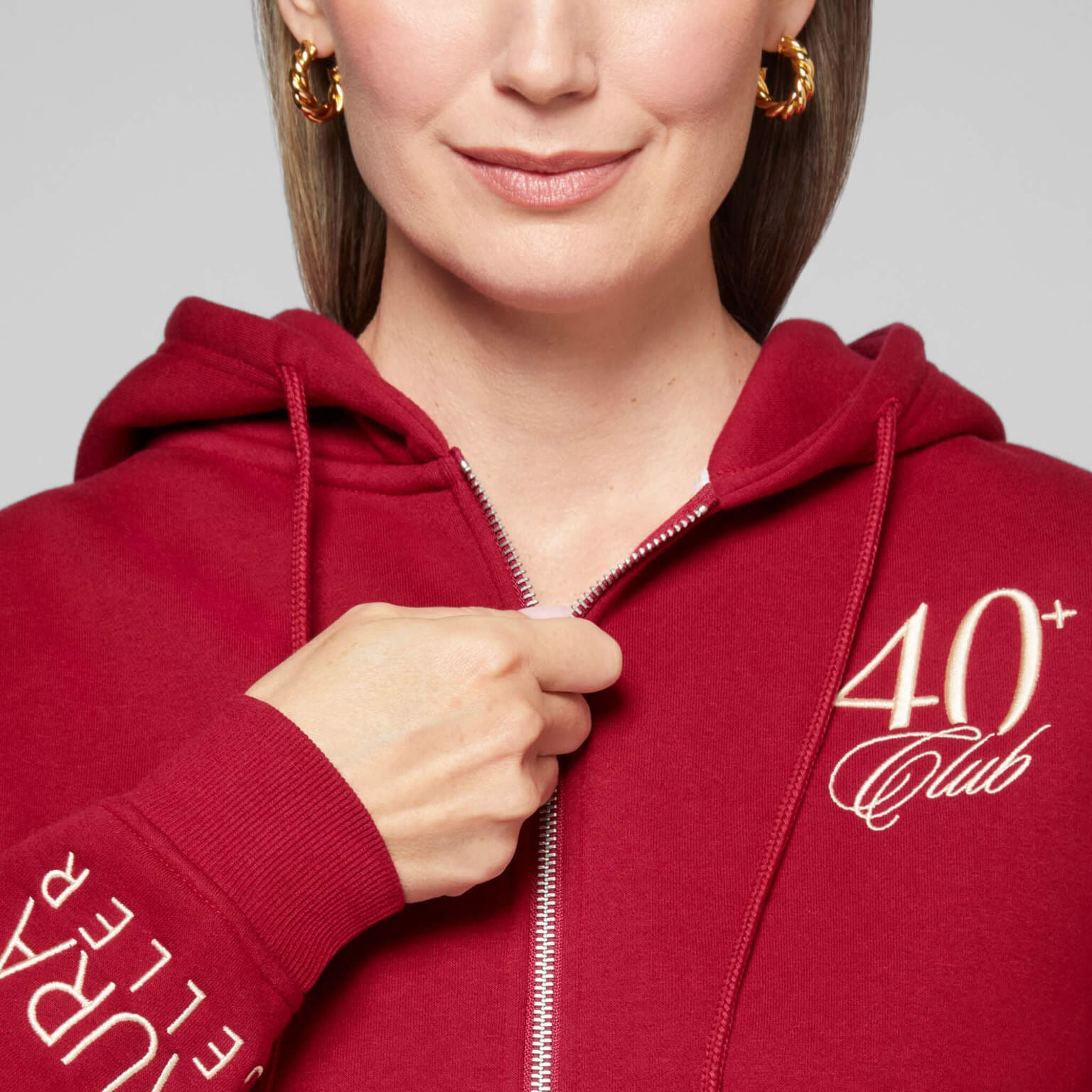 The 40+ Club Zip-Up Sweatshirt - model on zipper