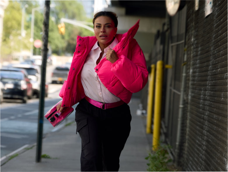 Dolores Catania wears a pink jacket while running