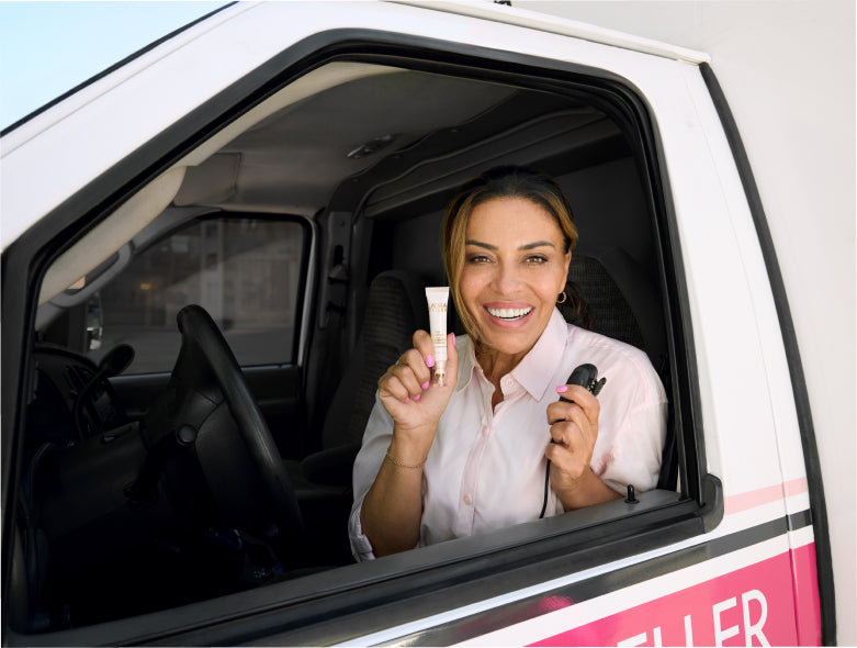 Dolores Catania holds Laura Geller Line Smoother in an Ambulance