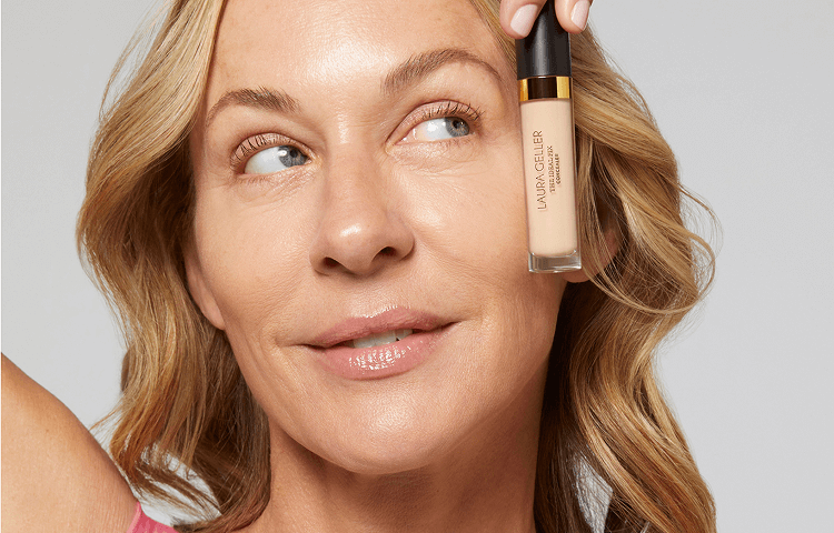 Model holding The Ideal Fix Concealer 