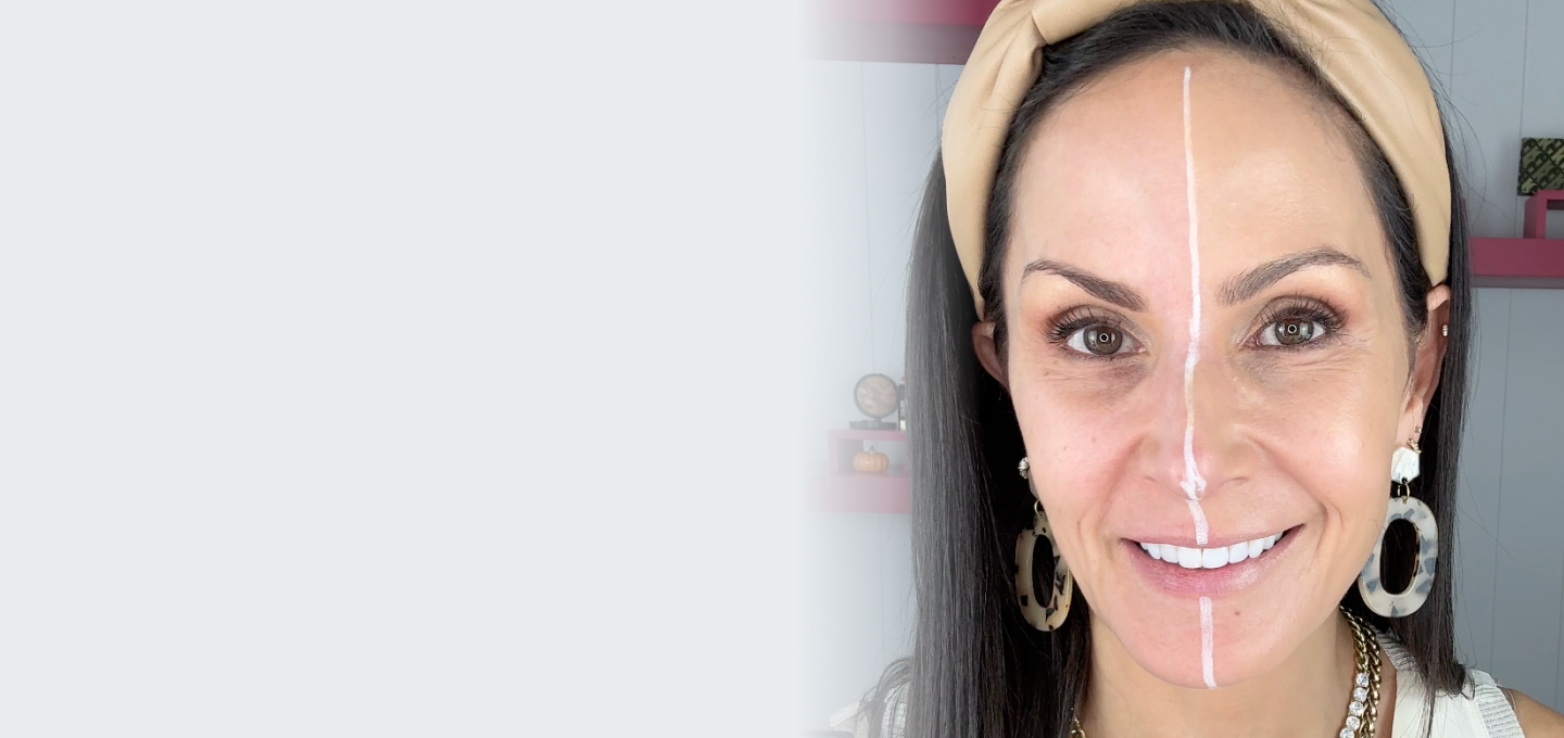 Woman with a white line drawn on her face to demonstrate the before and after effects of Laura Geller's Better Than Block.